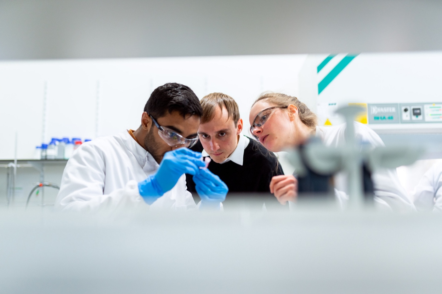 Lab technician looking at a sample