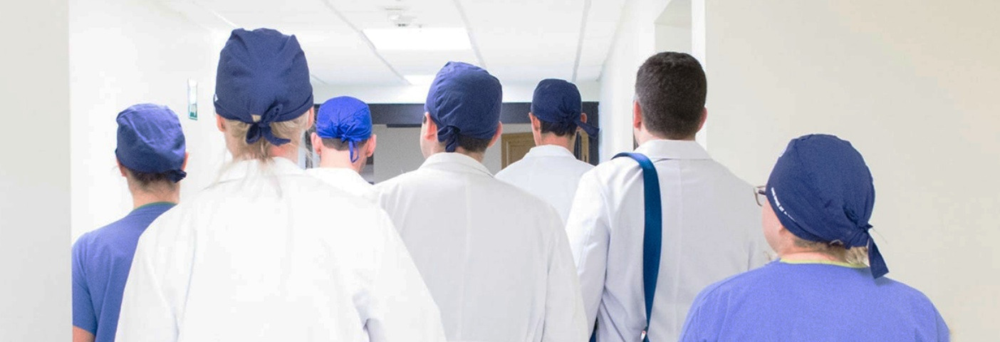 Medical team walking down a hall
